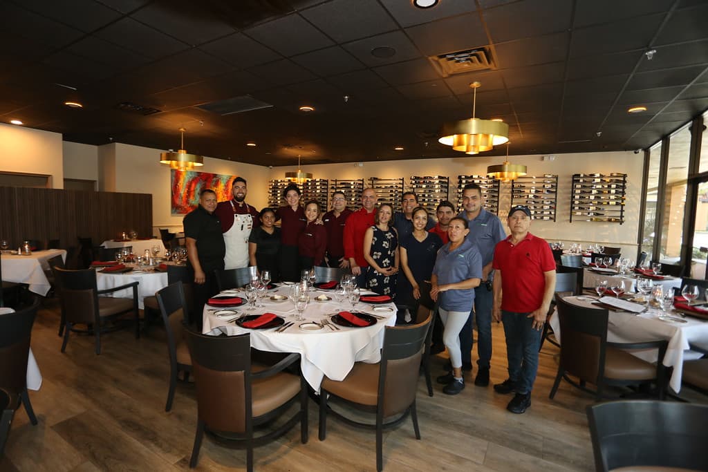 Team of professional staff at Cibao Grille, a fine continental restaurant in Naples, Florida, dedicated to exceptional service, elegance, and personalized hospitality.
