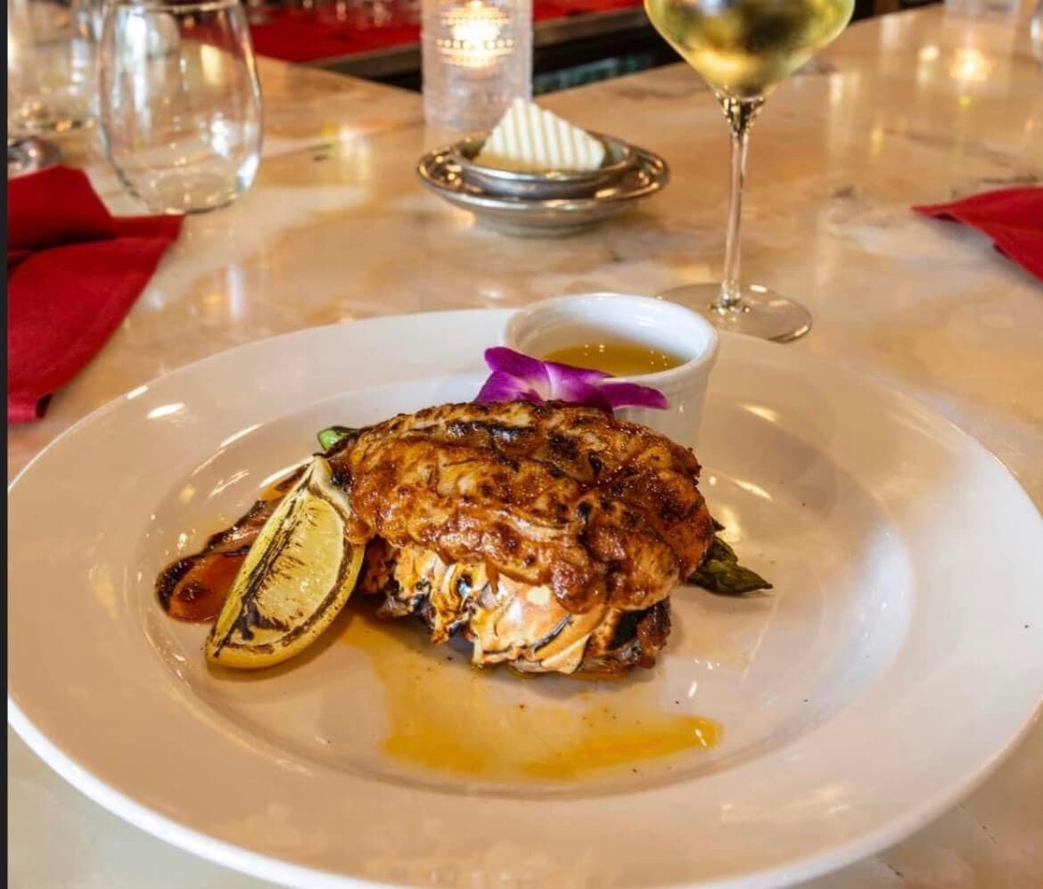 lobster tail at Cibao Grille in Naples, Florida, elegantly served with gourmet sides